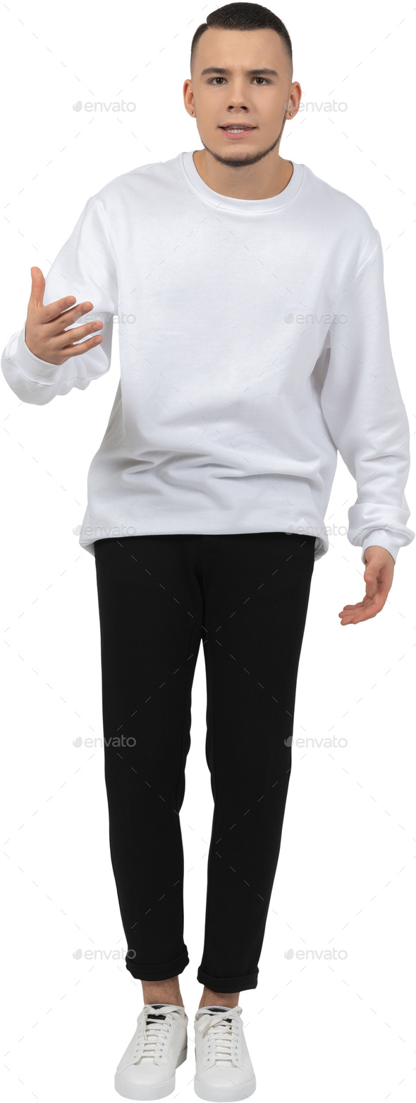 a man in a white sweatshirt and black pants