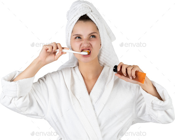 a woman brushing her teeth with a toothbrush and soap