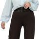 an older woman wearing a blue shirt and brown pants Stock Photo by