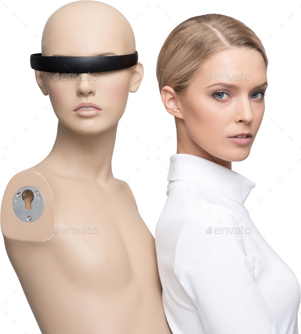 a mannequin with a head wearable device next to a woman with a shirt