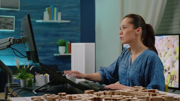 Woman Working As Architect Analyzing Virtual Maquette alt