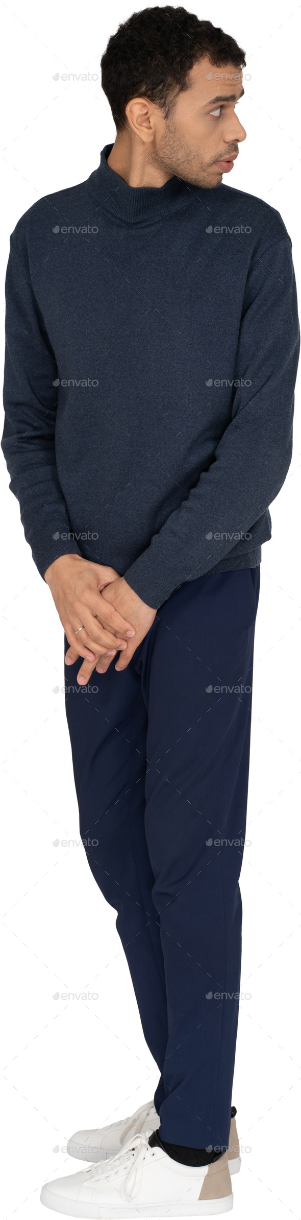 a man wearing a navy blue sweatshirt and blue pants with his hands on his