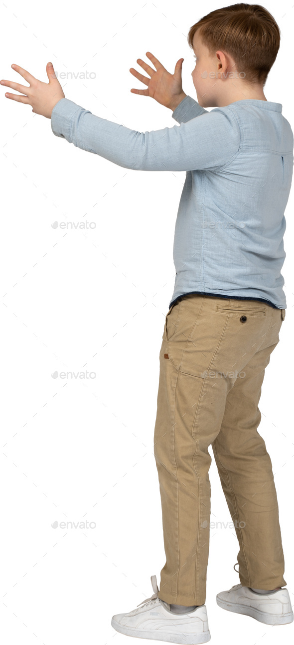 a young boy is standing with his arms outstretched Stock Photo by Icons8