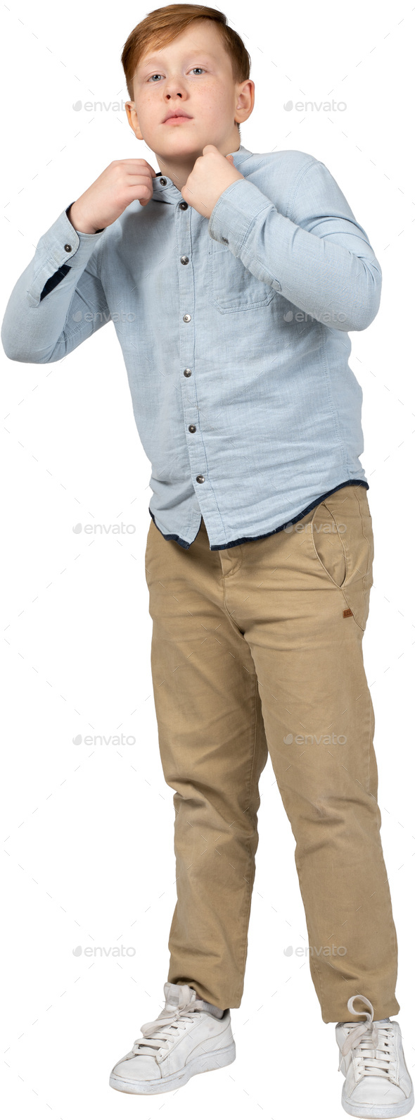 a young boy wearing a blue shirt and khaki pants Stock Photo by Icons8