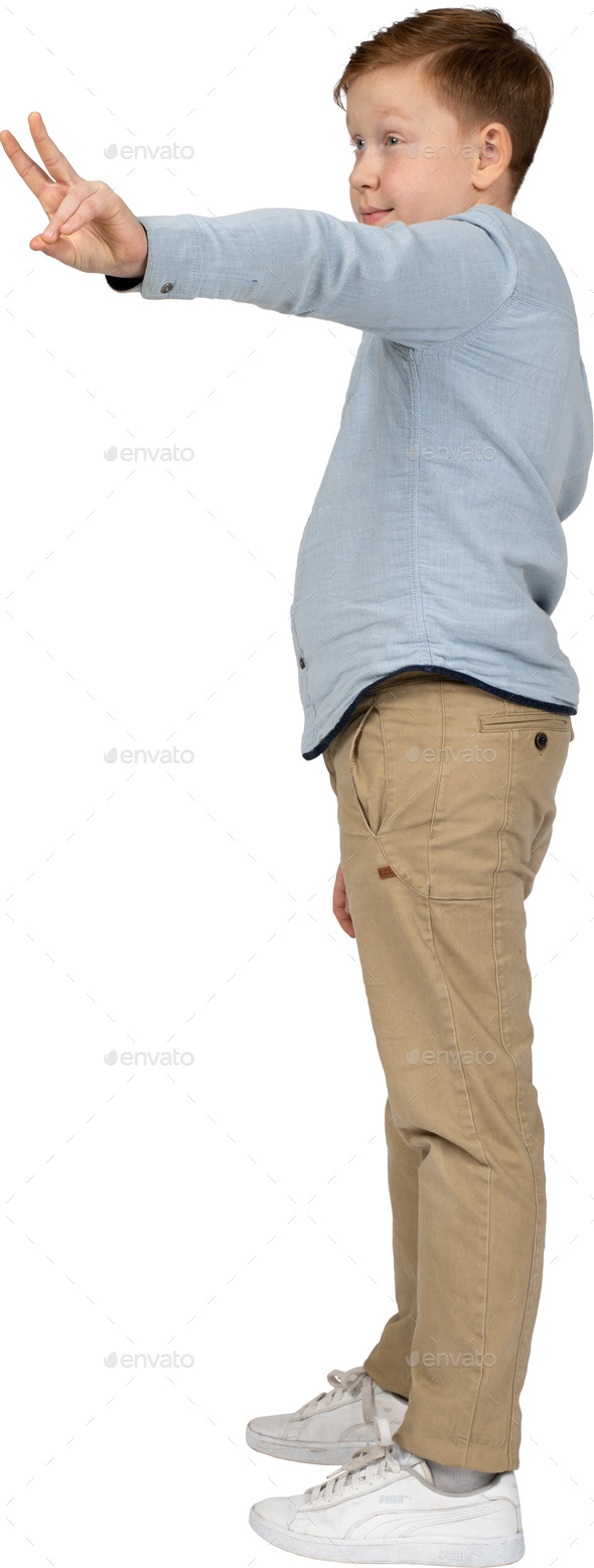 a young boy is standing with his arms outstretched Stock Photo by Icons8