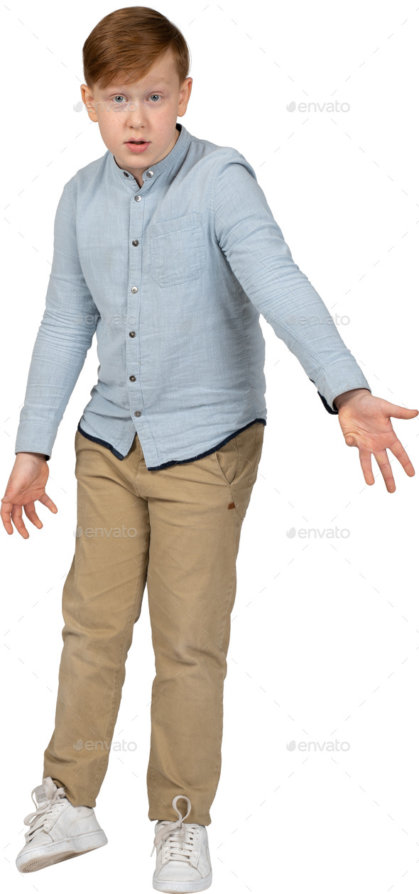 a young boy wearing a blue shirt and khaki pants Stock Photo by Icons8