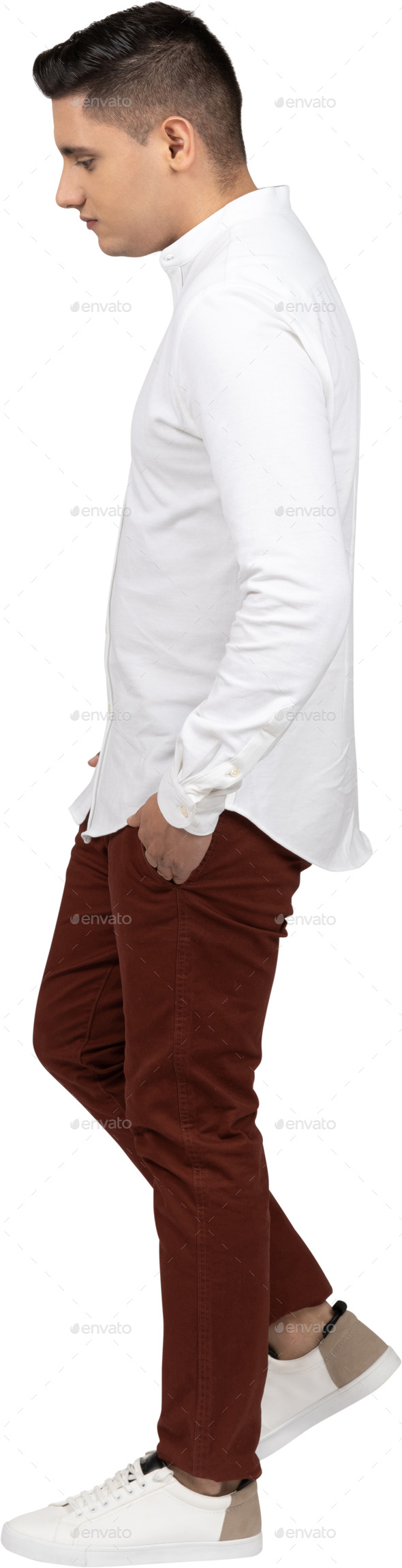 Confident Casual Man Walking Forward While Wearing Brown Pants And White  Shirt On White Studio Background Stock Photo, Picture and Royalty Free  Image. Image 124544063.
