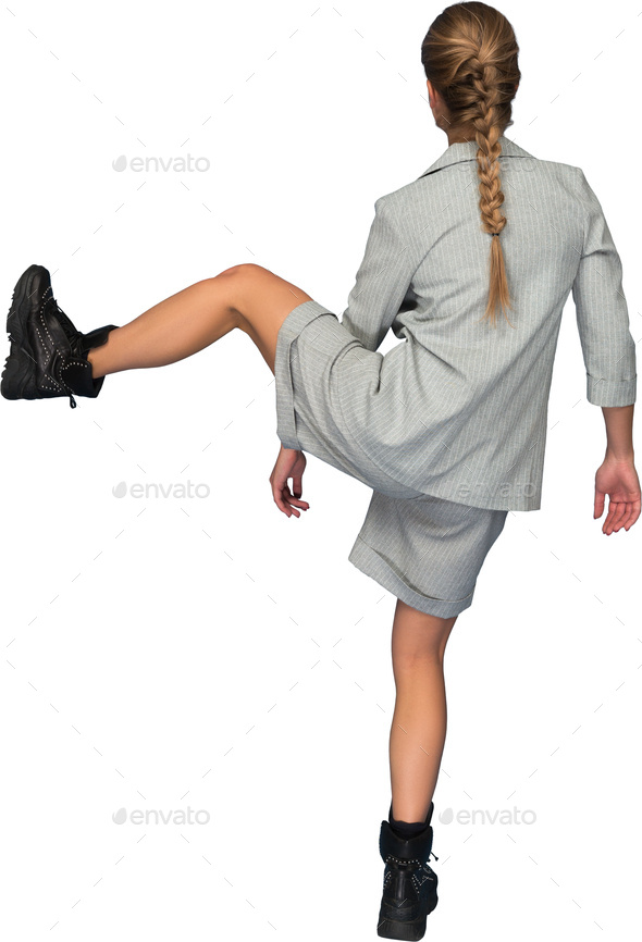 a woman kicking her leg up in the air