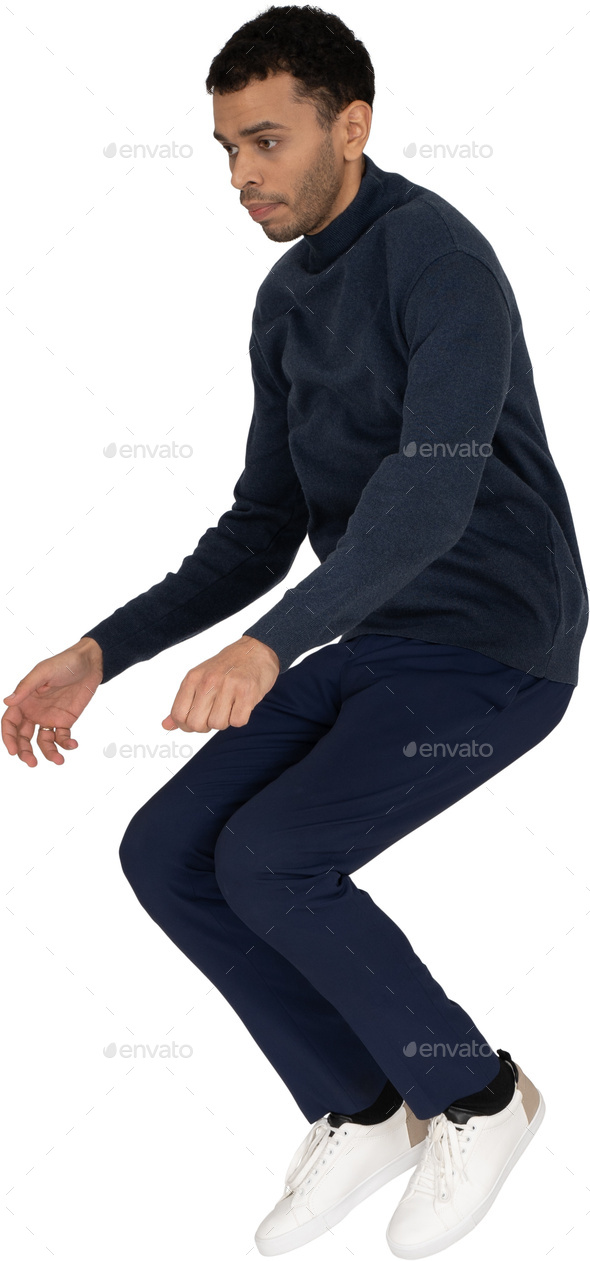 a man wearing navy blue pants and a navy blue sweater Stock Photo