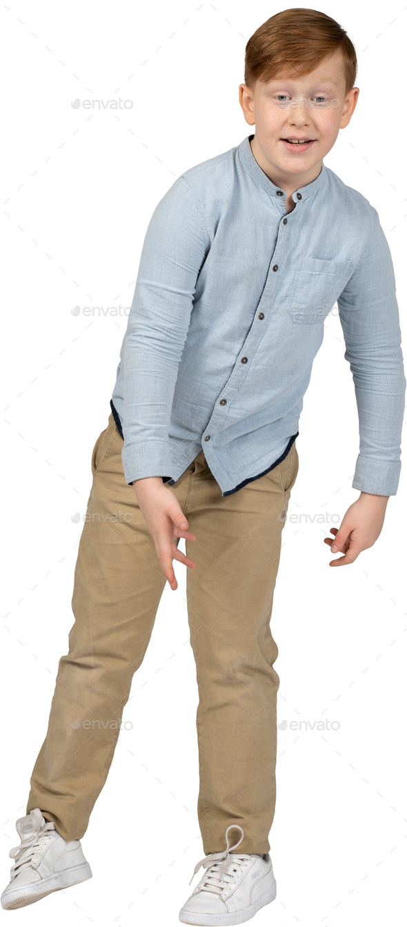 a young boy wearing a blue shirt and khaki pants Stock Photo by Icons8