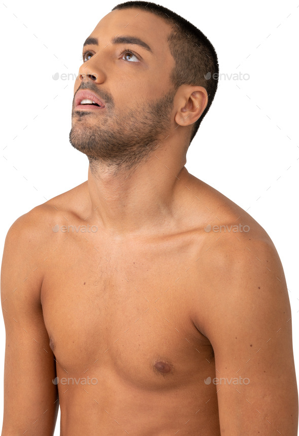 a man with no shirt on and looking up at the sky