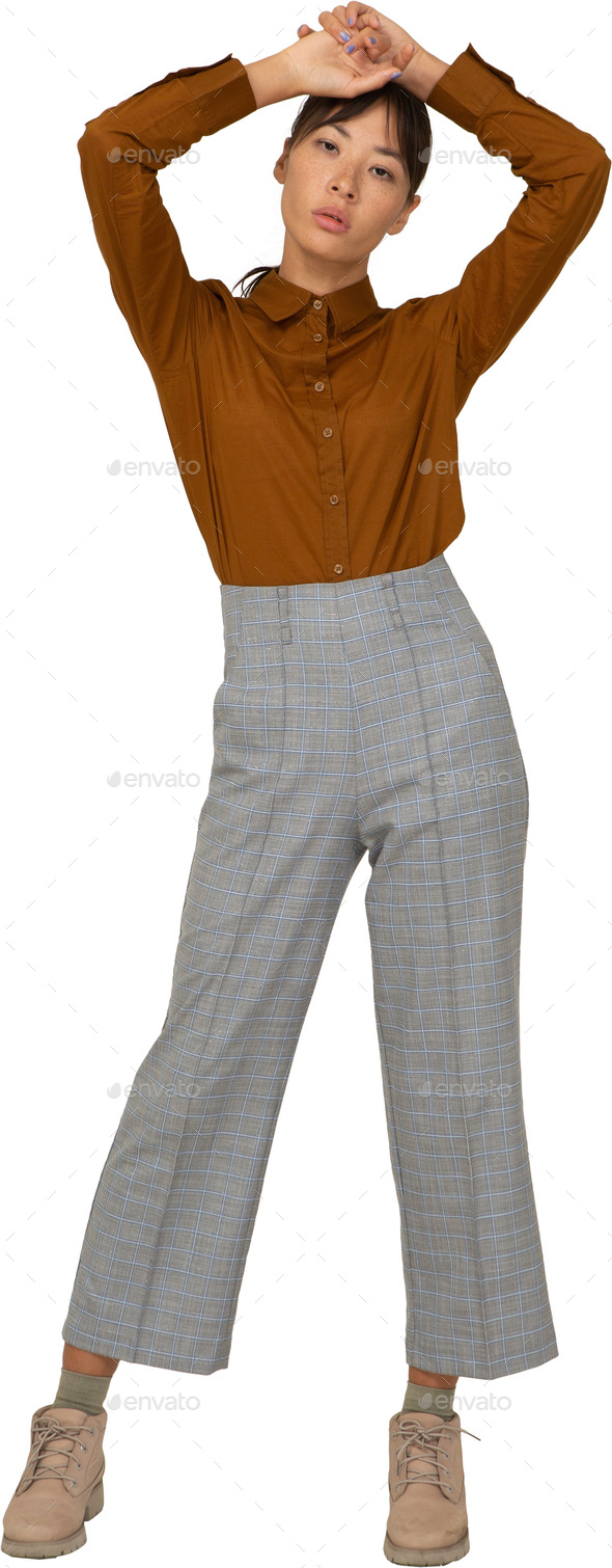 a woman in pajama pants and a brown shirt