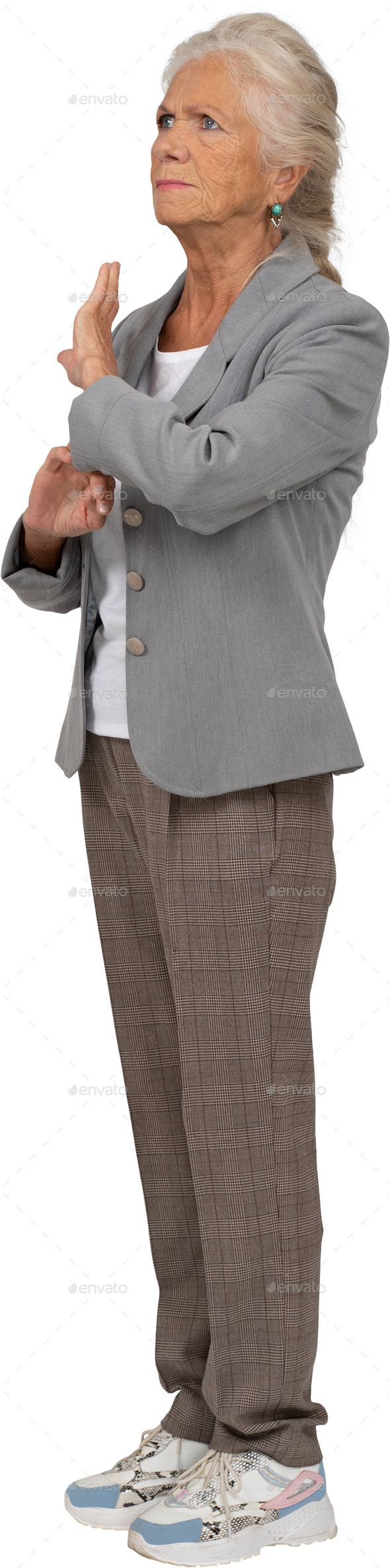 a woman in a gray suit and gray pants and a gray jacket - Stock Photo - Images