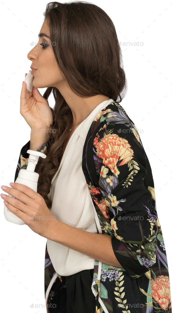a woman holding a nintendo wii game controller