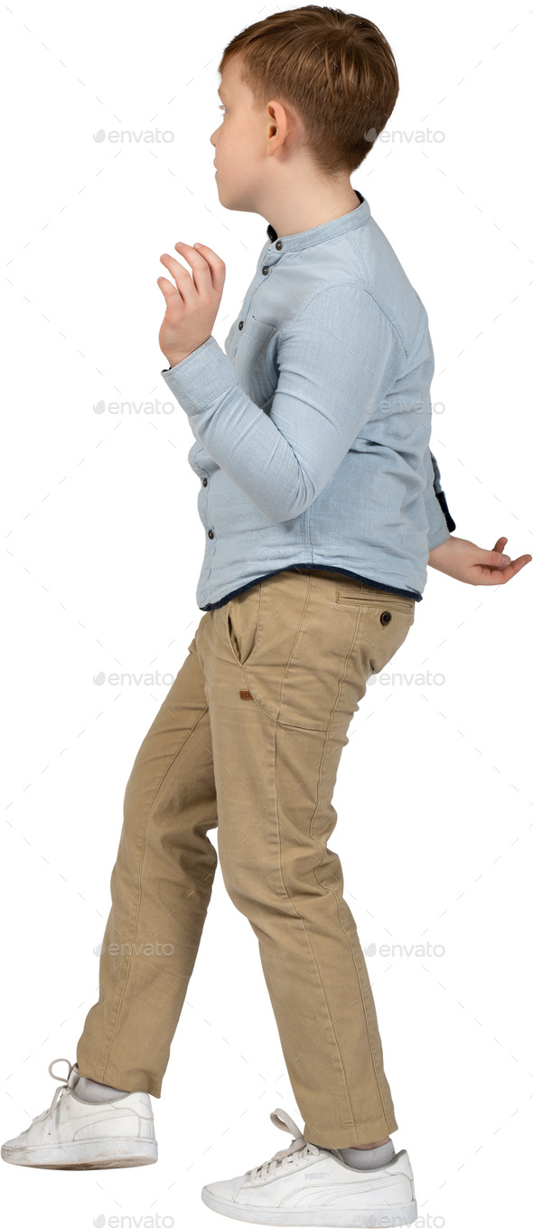 a young boy is standing with his arms outstretched Stock Photo by Icons8