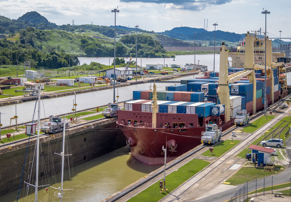 Ship crossing Panama Canal being lowered at Miraflores Locks - Panama City, Panama - Stock Photo - Images