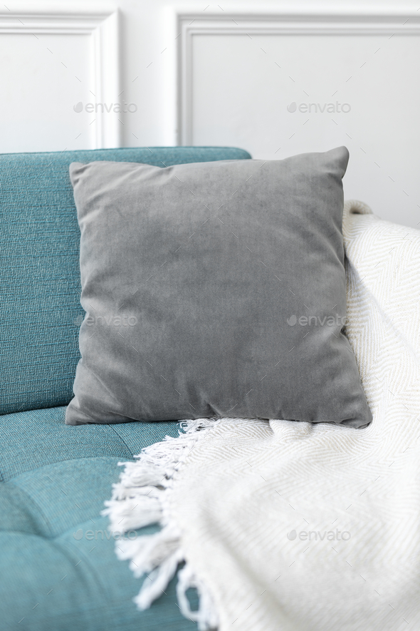 Minimal cushion cover in gray on a sofa