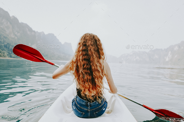 A canoe is sitting on the shore of a lake Image & Design ID 0000247443 -  SmileTemplates.com