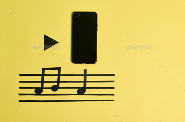 A phone and music notes on a yellow background. Play music