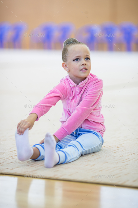 Adorable little girl athletes train in rhythmic gymnastics hall Stock ...