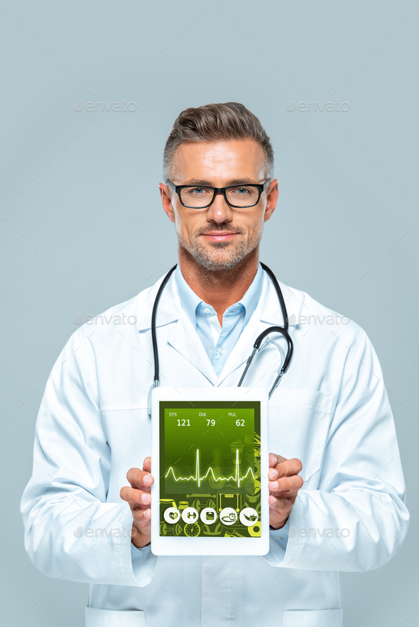 handsome doctor with stethoscope showing tablet with medical appliance isolated on white