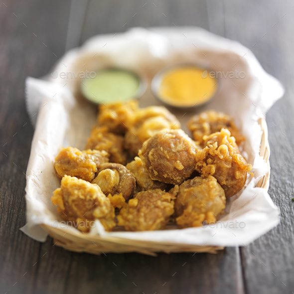 beer battered mushrooms with chipotle and jalapeno mayo dipping sauces Stock Photo by joshua_resnick