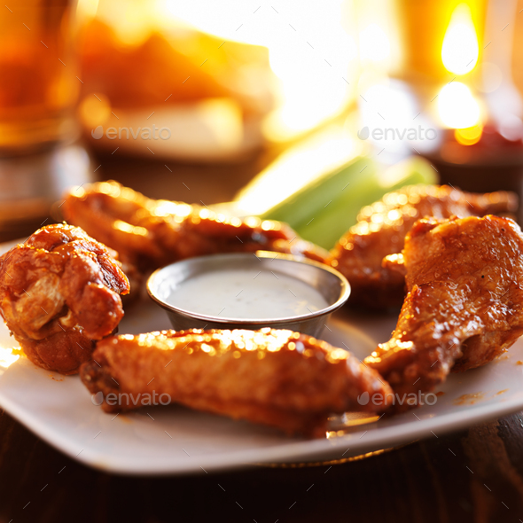 buffalo barbecue hot chicken wings around ranch sauce with celery Stock