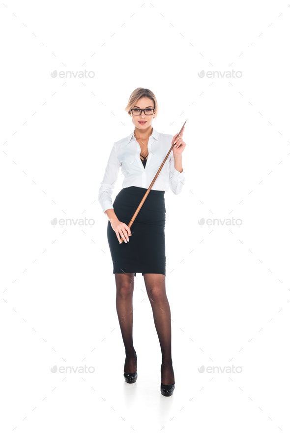 attractive blonde teacher in black skirt and blouse with open neckline holding pointer on white