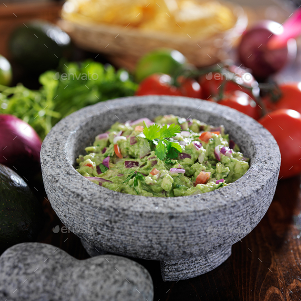 gaucamole in traditional mexican stone molcajete Stock Photo by joshua ...