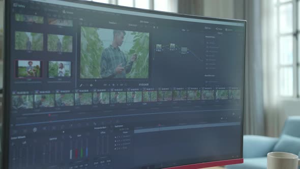 Close Up Of Asian Video Editor Man Using Desktop Computer For Editing Video While Working At Home alt