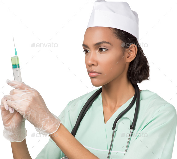 a nurse holding a syringe in her hand - Stock Photo - Images