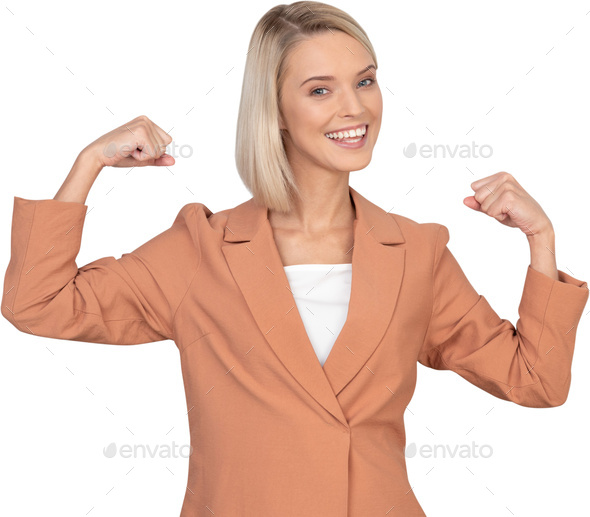 a woman in a brown suit with her fists in the air