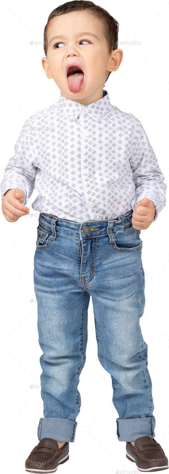 a little boy wearing jeans and a shirt with his mouth open Stock Photo
