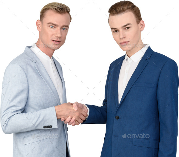 two men in blue suits shaking hands with each other Stock Photo by Icons8