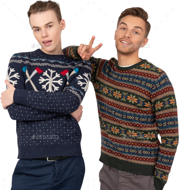 two men in ugly sweaters standing next to each other