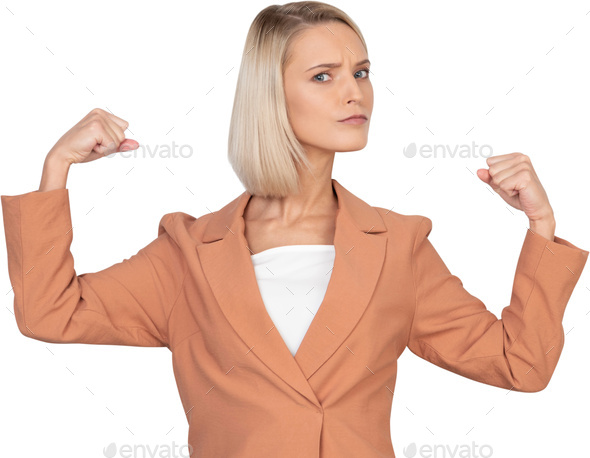 a woman in a suit with her fists in the air
