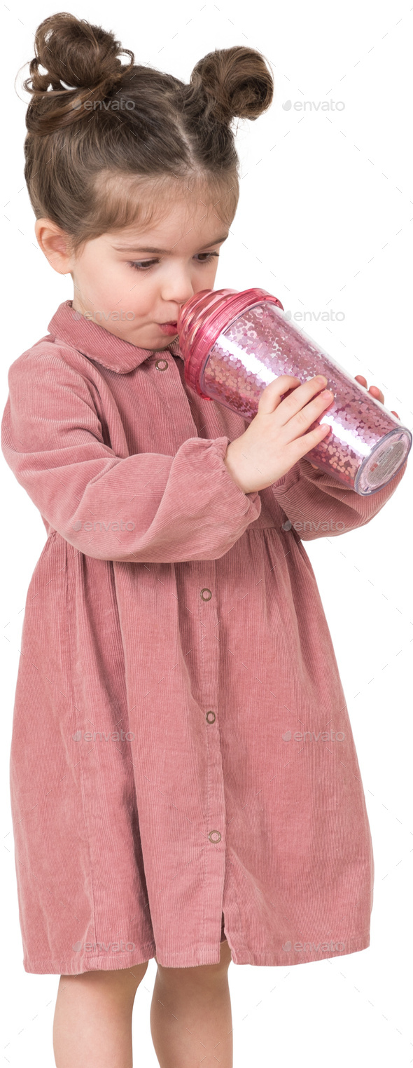 a little girl is drinking from a soda can