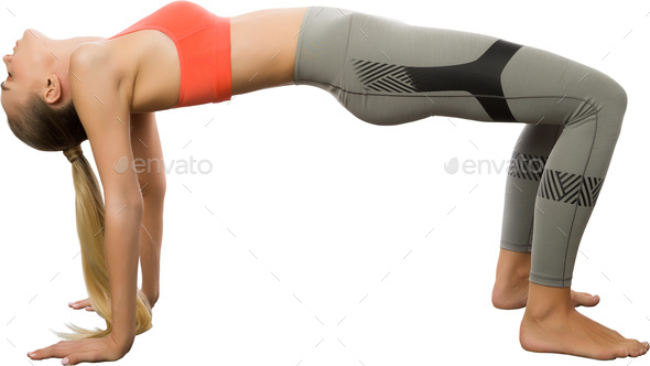 MODEL RELEASED. Woman practicing yoga. This is the kneeling wheel pose. -  SuperStock