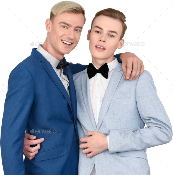 two men in blue suits and bow ties posing for a picture Stock Photo by ...