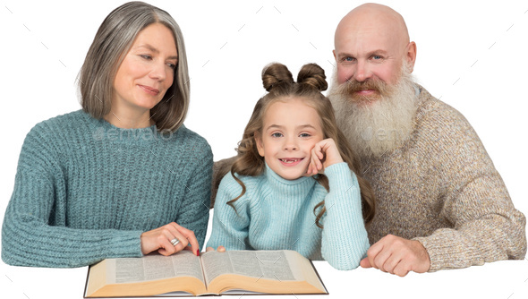 a little girl and her grandparents reading a book
