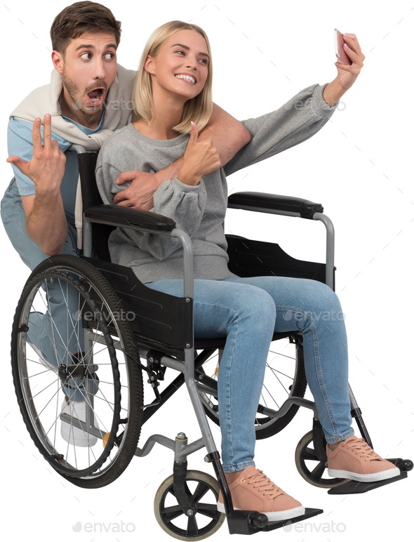 a man in a wheelchair and a woman in a manual wheelchair - Stock Photo - Images