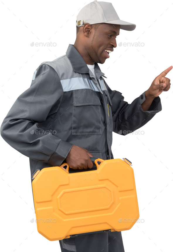 a man wearing a hat holding an orange tool box - Stock Photo - Images