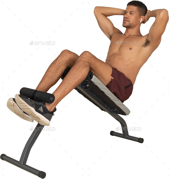 a man is sitting on a chair with his leg up in the air