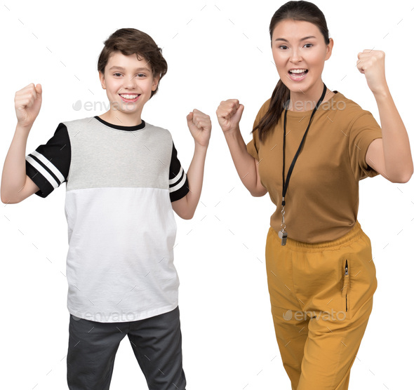 a boy and a girl with their fists in the air