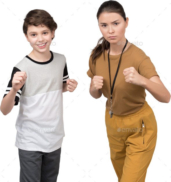 a young boy and a young girl holding their thumbs up - Stock Photo - Images