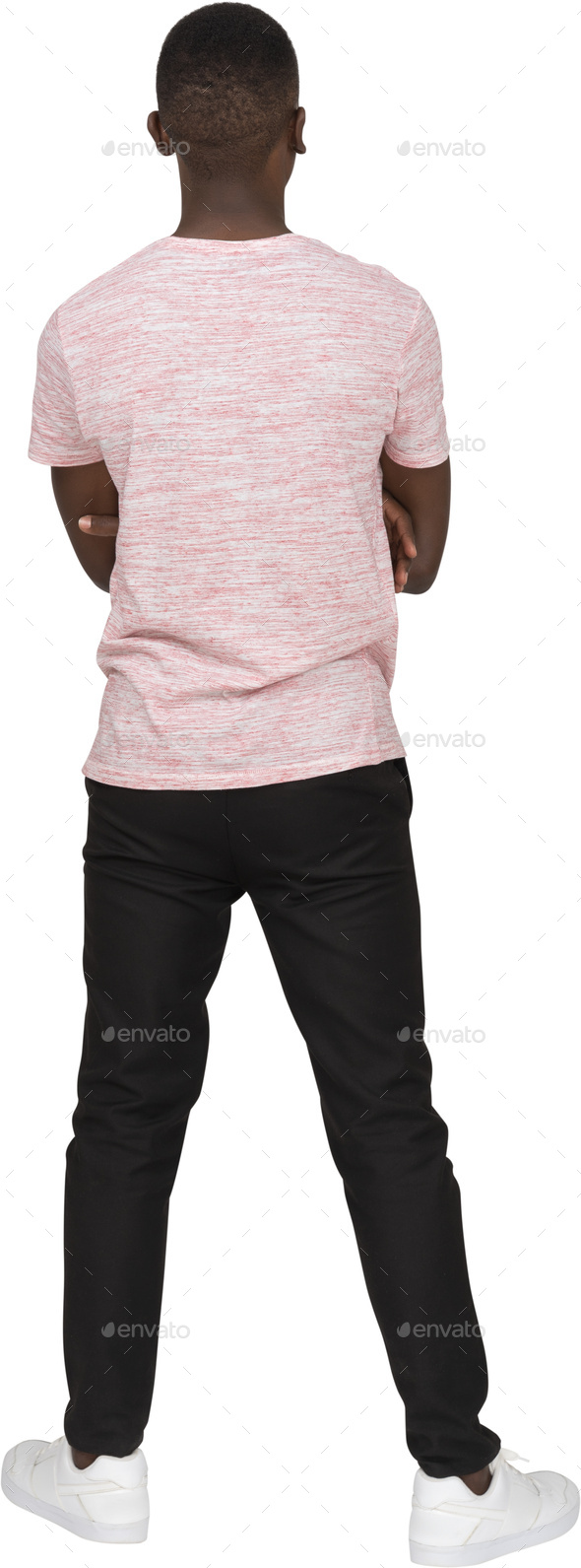 a young man wearing a pink shirt and black pants - Stock Photo - Images