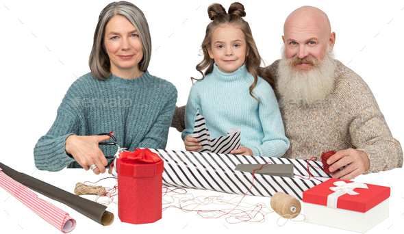 a family with a presents and a cake - Stock Photo - Images
