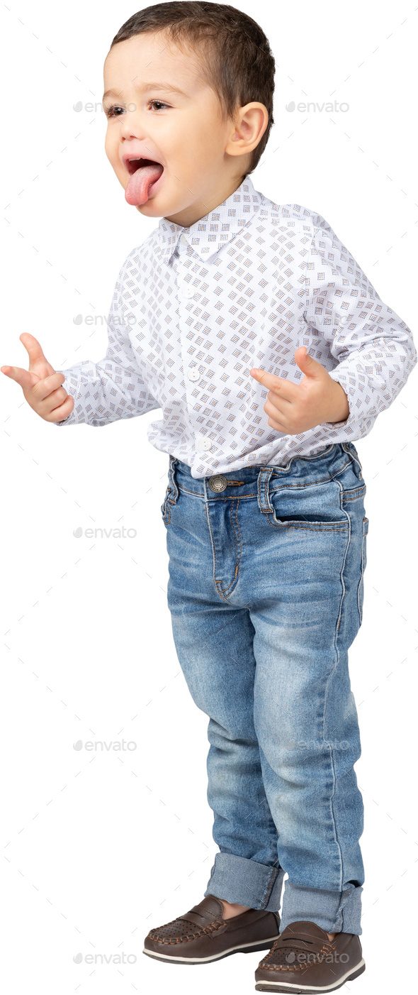 a little boy wearing jeans and a shirt and a shoe Stock Photo by Icons8