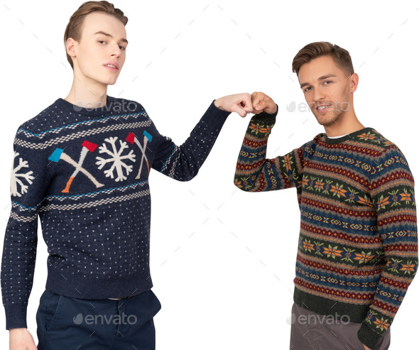 two men wearing ugly sweaters standing next to each other