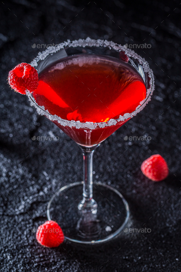 Red classic Margarita with raspberries. Classic Margarita in glass.